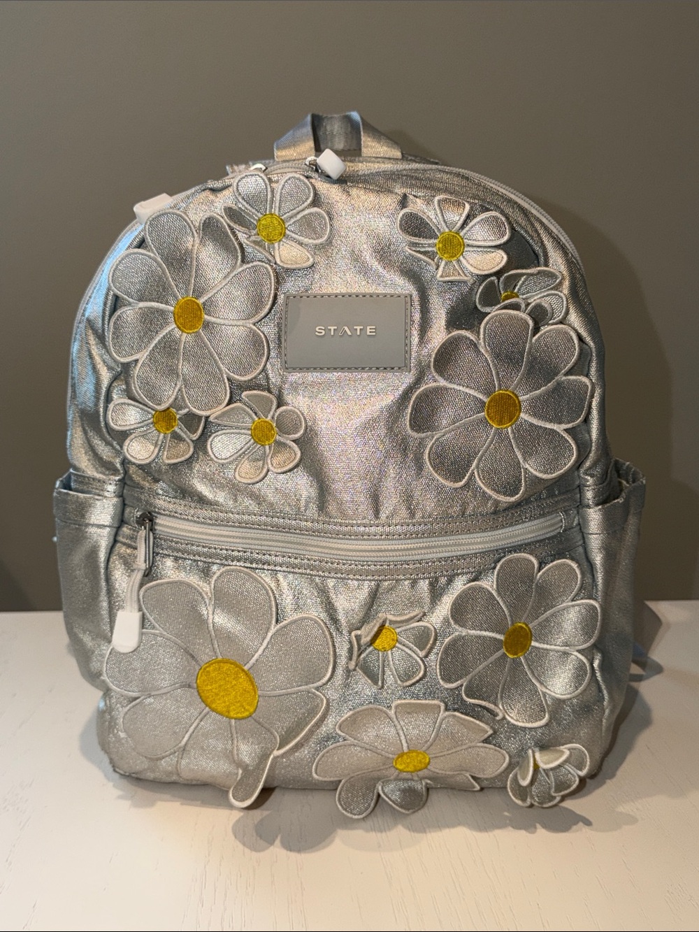 STATE Metallic Silver Daisy Patch Kane Kids Mini Backpack